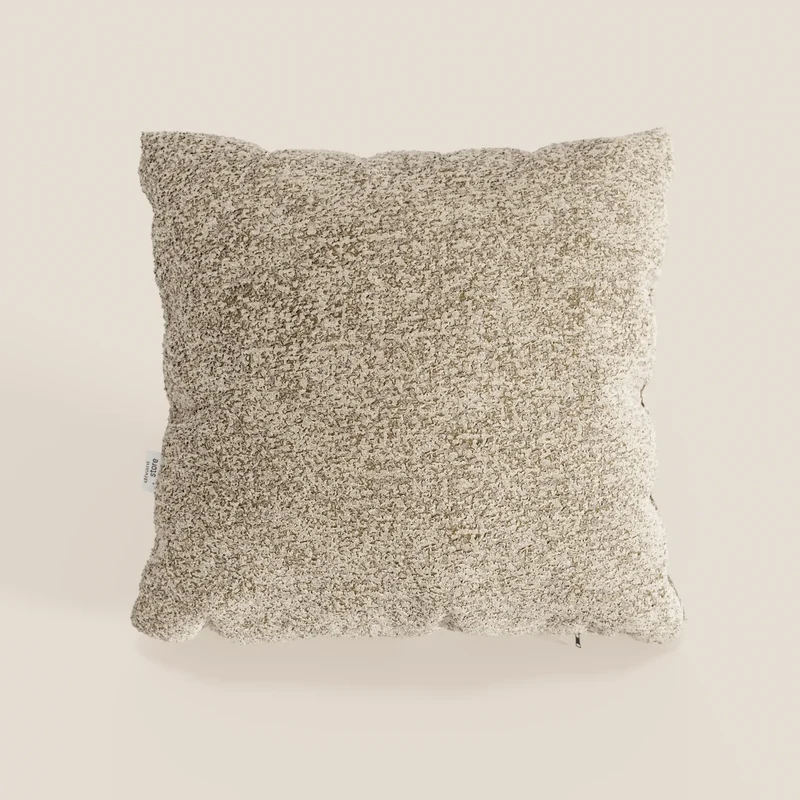 Magnolia cuscino disponibile in diversi colori realizzato in pregiato bouclé mélange morbido e strutturato T29.